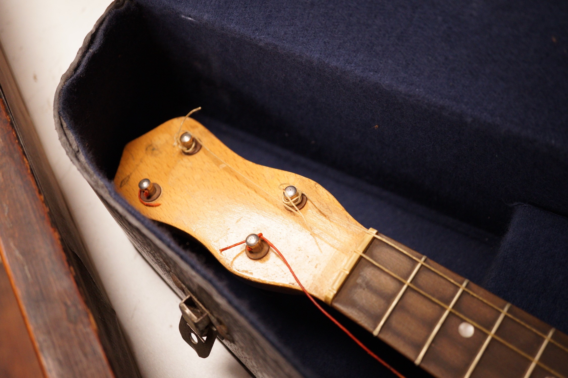 A ukelele banjo in case